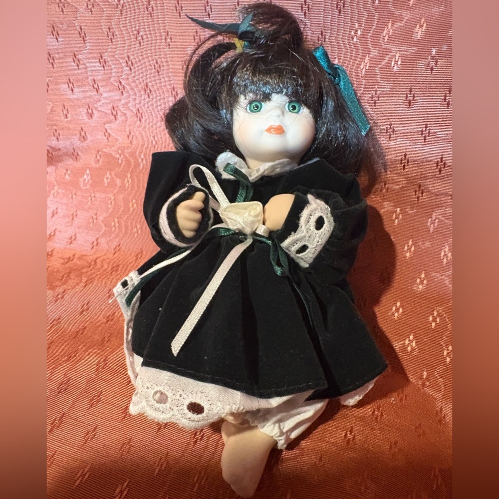 Vintage Porcelain Doll with Green Dress